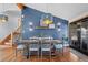 Stylish dining room with modern lighting, wood floors, and adjacent access to outdoors at 255 Kiowa Pl, Boulder, CO 80303