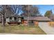 Charming brick home with a well-manicured lawn, mature trees, and inviting curb appeal at 255 Kiowa Pl, Boulder, CO 80303