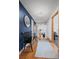 Hallway with white and blue walls leading to the living room and bedroom at 255 Kiowa Pl, Boulder, CO 80303