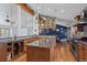 Open kitchen with stainless steel appliances, granite countertops, and a large center island at 255 Kiowa Pl, Boulder, CO 80303