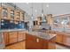 A bright kitchen features wooden cabinetry and granite countertops with a center island at 255 Kiowa Pl, Boulder, CO 80303