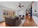 Spacious living room featuring hardwood floors, large windows, and a ceiling fan at 255 Kiowa Pl, Boulder, CO 80303