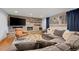 Spacious living room featuring a stone accent wall with fireplace, large couch, and stylish decor at 255 Kiowa Pl, Boulder, CO 80303