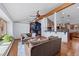 Open-concept living room with hardwood floors, exposed beams, and abundant natural light at 255 Kiowa Pl, Boulder, CO 80303