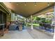 Covered outdoor patio with comfortable seating, dining area, and views of the backyard at 255 Kiowa Pl, Boulder, CO 80303