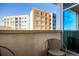 Relaxing balcony offers an open-air retreat and views of surrounding buildings on a sunny day at 1700 Bassett St # 409, Denver, CO 80202