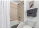 Clean bathroom features a shower-tub combination with neutral tile and modern fixtures at 1700 Bassett St # 409, Denver, CO 80202