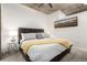 Comfortable bedroom featuring a queen bed, soft lighting and a decorative piece of art at 1700 Bassett St # 409, Denver, CO 80202