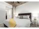 Comfortable bedroom showcases a king bed, concrete accents, and ample closet space at 1700 Bassett St # 409, Denver, CO 80202