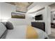 Serene bedroom with neutral tones, stylish decor, and sleek furniture for a relaxing ambiance at 1700 Bassett St # 409, Denver, CO 80202