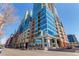 Stunning glass facade and brick accents highlight this residential high-rise in a vibrant urban neighborhood at 1700 Bassett St # 409, Denver, CO 80202