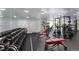 Bright gym with a variety of weightlifting equipment including benches, squat racks, and dumbbell sets at 1700 Bassett St # 409, Denver, CO 80202