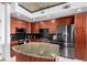 Contemporary kitchen showcasing granite counters, modern appliances, and wooden cabinets at 1700 Bassett St # 409, Denver, CO 80202