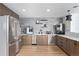 Modern kitchenette with stainless steel appliances, sleek cabinetry, and a stylish backsplash for an upscale feel at 1700 Bassett St # 409, Denver, CO 80202