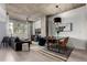 Modern living room featuring concrete ceilings, light wood floors, stylish furnishings, and an open floor plan perfect for entertaining at 1700 Bassett St # 409, Denver, CO 80202