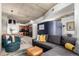 Stylish living room features a comfortable couch, accent seating, and an open floor plan at 1700 Bassett St # 409, Denver, CO 80202