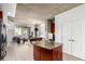 Open concept living area with kitchen island, dining table and comfortable living room set at 1700 Bassett St # 409, Denver, CO 80202
