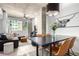 Bright living space with open floor plan featuring dining area and comfortable seating, art and natural light at 1700 Bassett St # 409, Denver, CO 80202
