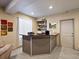 Basement bar area with granite countertop, storage shelves, and room for entertaining at 10883 E 163Rd Ct, Brighton, CO 80602