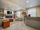 The finished basement is a perfect entertainment space and features a custom bar at 10883 E 163Rd Ct, Brighton, CO 80602