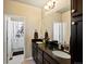 This spacious bathroom is equipped with dual sinks, granite countertops and modern fixtures at 10883 E 163Rd Ct, Brighton, CO 80602