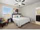 This relaxing bedroom includes a plush bed, patterned chair and bright natural light at 10883 E 163Rd Ct, Brighton, CO 80602