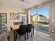 Bright dining room with modern light fixture and large sliding glass doors to outdoor area at 10883 E 163Rd Ct, Brighton, CO 80602