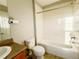 Traditional bathroom features a sink, toilet, and bathtub with white tiles at 21993 E Jamison Pl, Aurora, CO 80016