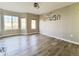 Bedroom features a modern ceiling fan and a large window with lots of natural light at 21993 E Jamison Pl, Aurora, CO 80016