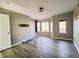 Bright living room features hardwood floors and natural light from the large bay window at 21993 E Jamison Pl, Aurora, CO 80016