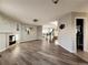 Open living space with wood floors leads to stairs, bathroom and connects seamlessly at 21993 E Jamison Pl, Aurora, CO 80016