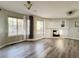 Sun-filled living room boasts a fireplace, large windows, and neutral paint tones at 21993 E Jamison Pl, Aurora, CO 80016