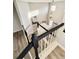Bright, open staircase features wood floors and black and white railings at 21993 E Jamison Pl, Aurora, CO 80016