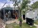 Backyard features a covered patio area, grill, tree, and leads to an open yard space at 188 S Dale Ct, Denver, CO 80219