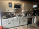 Basement with cabinets, workbench, and ample storage space at 188 S Dale Ct, Denver, CO 80219