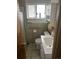 Compact bathroom with a new vanity, tiled walls, and shower featuring safety bars at 188 S Dale Ct, Denver, CO 80219