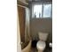Small bathroom featuring a shower, toilet, and tile accents at 188 S Dale Ct, Denver, CO 80219