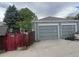 Spacious two-car garage with concrete driveway and traditional doors at 188 S Dale Ct, Denver, CO 80219