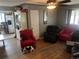 Cozy living room featuring hardwood floors, ceiling fan, and neutral-colored walls at 188 S Dale Ct, Denver, CO 80219
