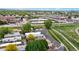 Expansive aerial view capturing a park, water features and the neighborhood surroundings at 8509 Colorado Ct, Denver, CO 80229