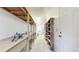 Basement featuring built-in shelving and workbench, offering plenty of storage space at 8509 Colorado Ct, Denver, CO 80229