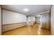 This is a bedroom with hard wood floors and mirrored closet doors, and an ensuite bathroom at 8509 Colorado Ct, Denver, CO 80229
