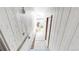 Exterior walkway between two manufactured homes with white siding and a concrete walkway at 8509 Colorado Ct, Denver, CO 80229