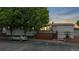 Charming single story home featuring a cozy front deck and mature trees at 8509 Colorado Ct, Denver, CO 80229