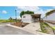 View of cozy single story home featuring a covered carport and landscaped front yard at 8509 Colorado Ct, Denver, CO 80229
