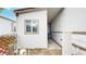 Exterior view of the side of the house with white siding and a lattice fence at 8509 Colorado Ct, Denver, CO 80229