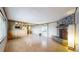 View of open concept living room with stone fireplace and hardwood floors at 8509 Colorado Ct, Denver, CO 80229