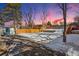 Large backyard with wooden fence and snow at 4140 S Inca St, Englewood, CO 80110