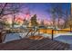 Wooden deck overlooking a snowy backyard at 4140 S Inca St, Englewood, CO 80110