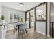 Charming dining area with a round table and four chairs, adjacent to the kitchen at 4140 S Inca St, Englewood, CO 80110